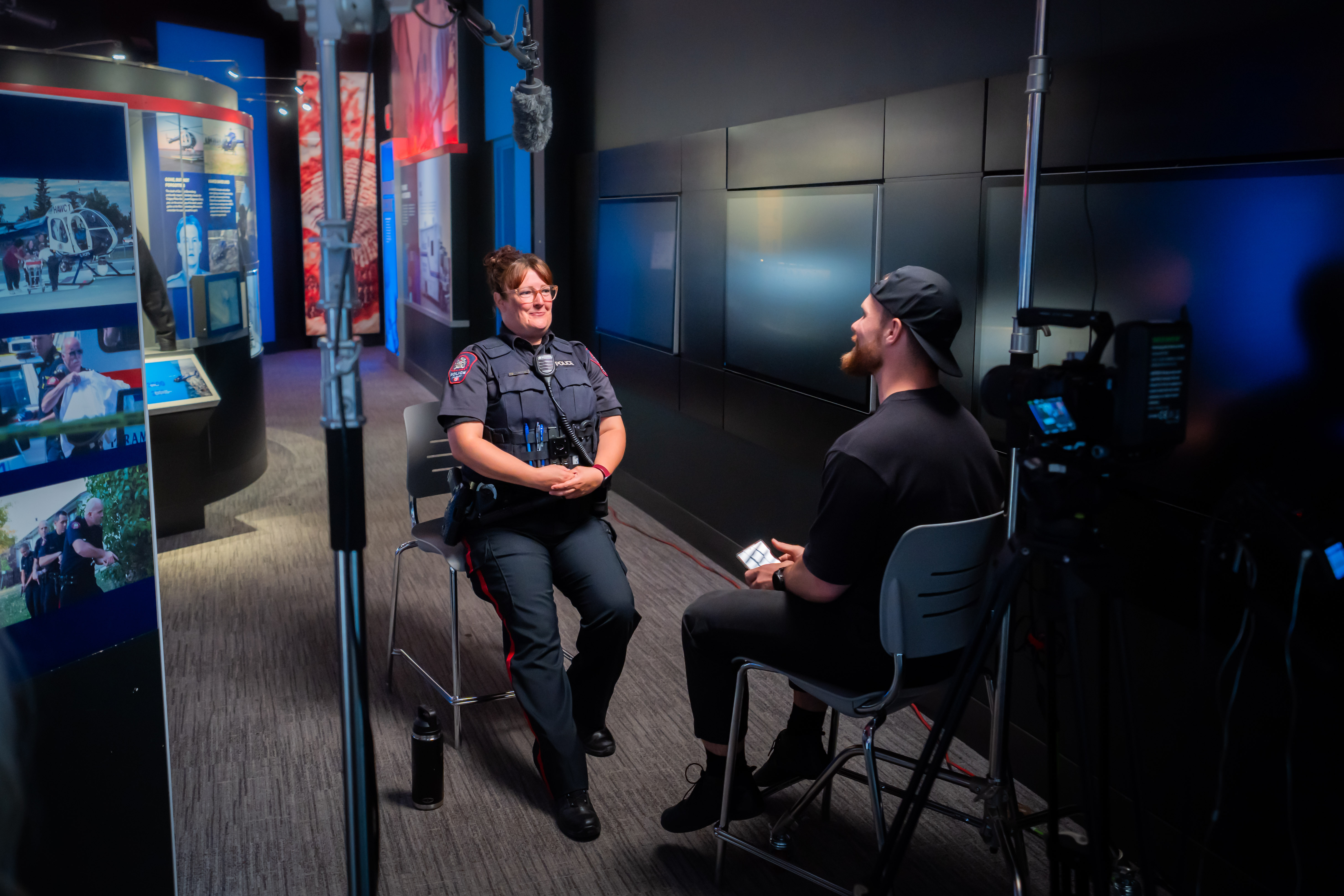 overview of the filming of social media content, showing the Labeled team recording a calgary police officer